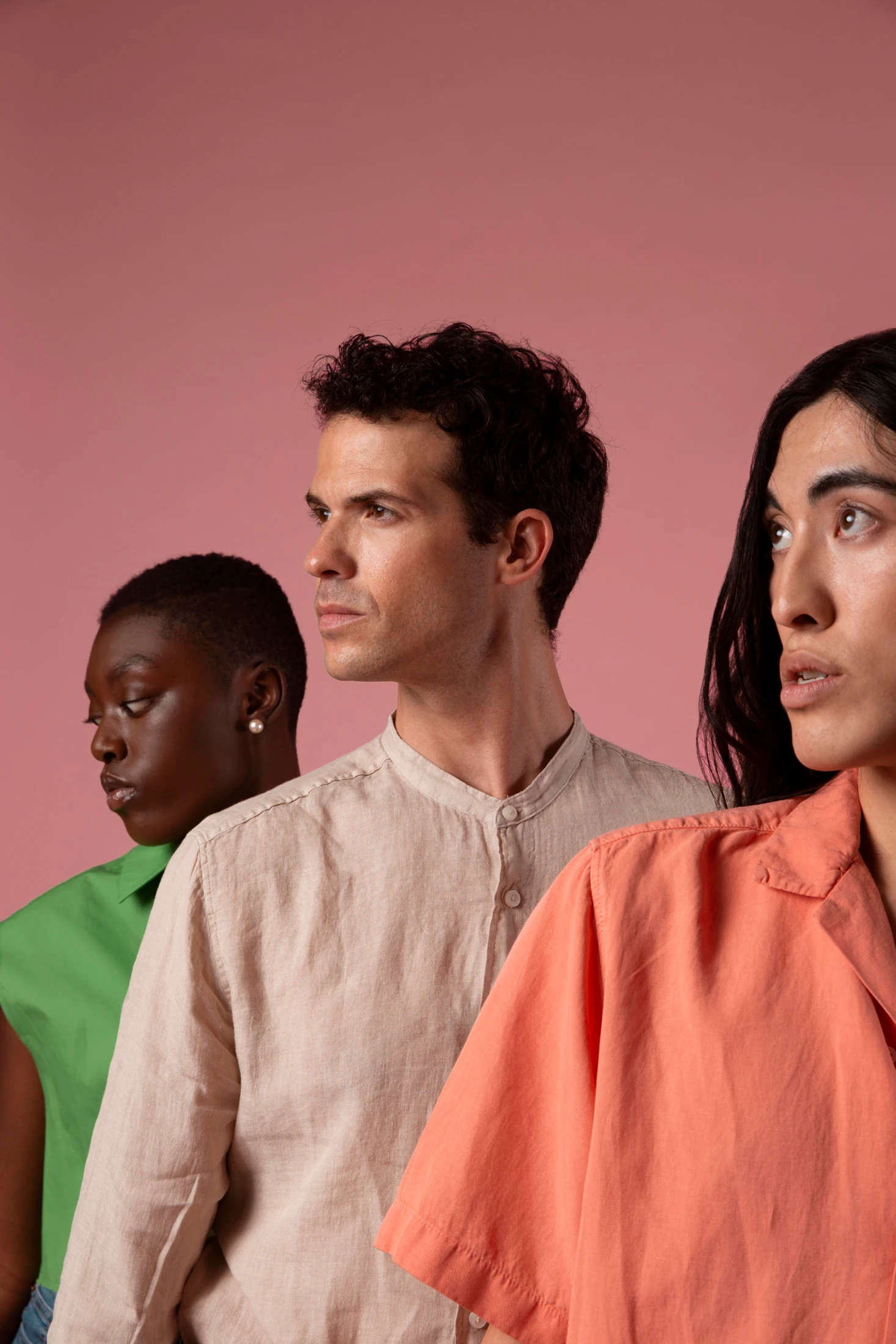 Three people looking toward a shared direction